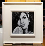 Amy Winehouse painting in white frame