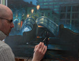 Artist Vincent Keeling at his easel painting The Ha'penny Bridge, Dublin City, Ireland