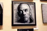 Framed Michael Stipe portrait hanging on gallery wall